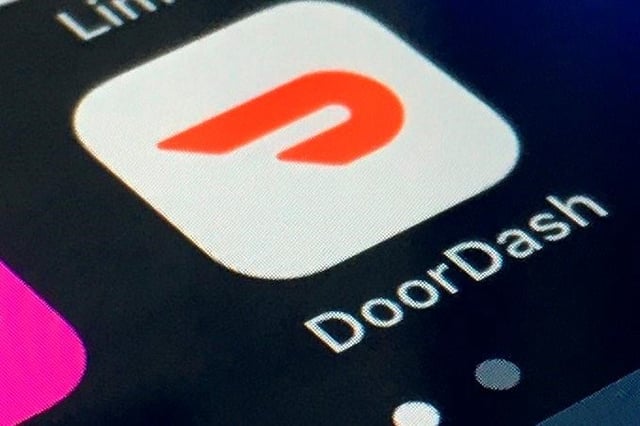 In this Feb. 27, 2020, file photo, the DoorDash app is shown on a smartphone in New York. 