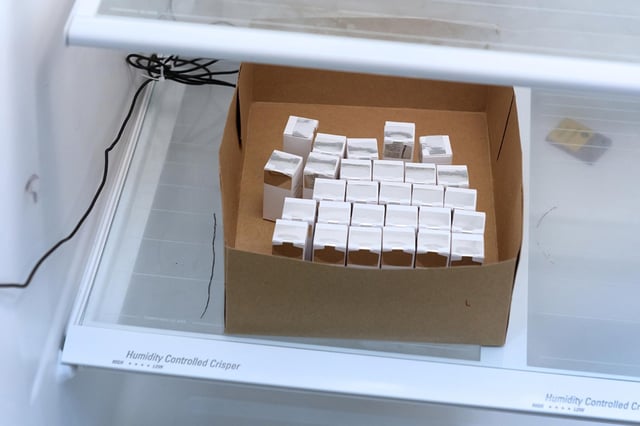 Boxes containing vials of Moderna&#39;s COVID-19 vaccine, known as mRNA-1273, are refrigerated at the Clinical Research Institute of Southern Oregon in Medford.