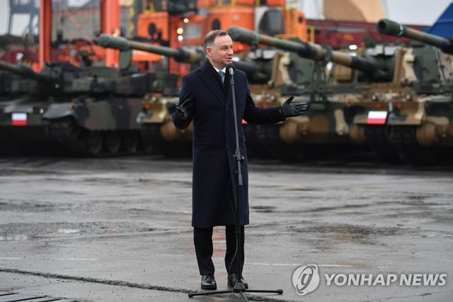 This EPA file photo shows Polish President Andrzej Duda attending a ceremony marking the delivery of K2 tanks to Poland in the port city of Gdynia. (Yonhap)