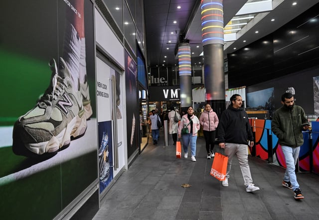 Shoppers walk out of a mall in Sydney's CBD in Sydney, Australia, July 3, 2024. REUTERS/Jaimi Joy/File Photo