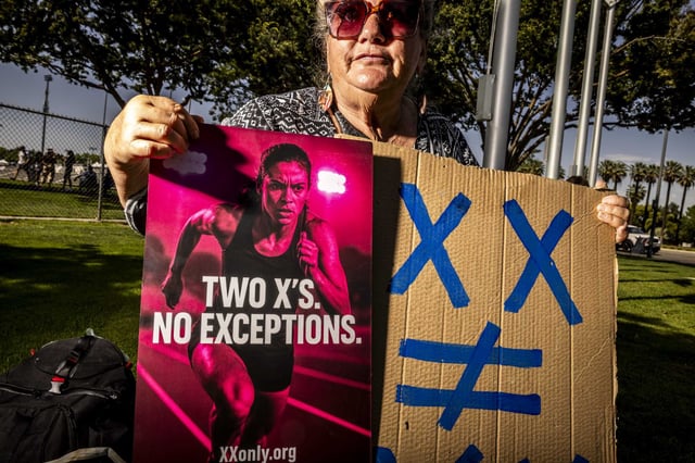 Lisa Edwards, of Fresno, protests the presence of a transgender athlete in the state track and field championships May 30.