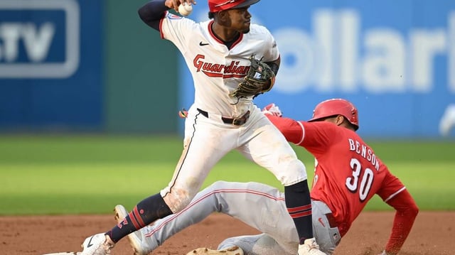 Jun 9, 2025; Cleveland, Ohio, USA; Cleveland Guardians second baseman Angel Martinez (1) forces out Cincinnati Reds left fielder Will Benson (30) and turns the double play during the fourth inning at Progressive Field. Mandatory Credit: Ken Blaze-Imagn Images