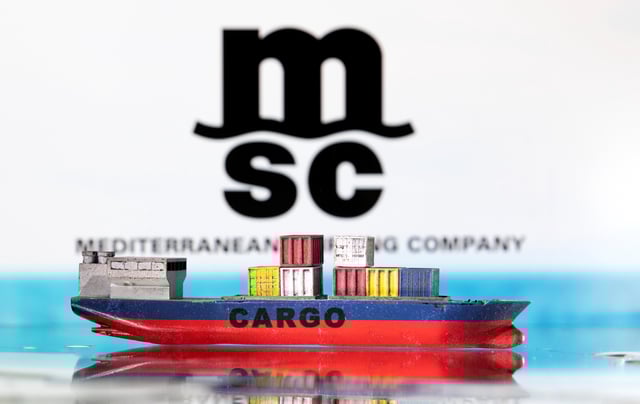 A cargo ship boat model is pictured in front of the Mediterranean Shipping Company (MSC) logo in this illustration taken March 3, 2022. REUTERS/Dado Ruvic/Illustration/File Photo