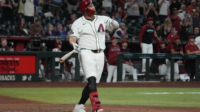 Jun 9, 2025; Phoenix, Arizona, USA; Arizona Diamondbacks first base Josh Naylor (22) hits a walk off grand slam home run against the Seattle Mariners in the eleventh inning at Chase Field. Mandatory Credit: Rick Scuteri-Imagn Images