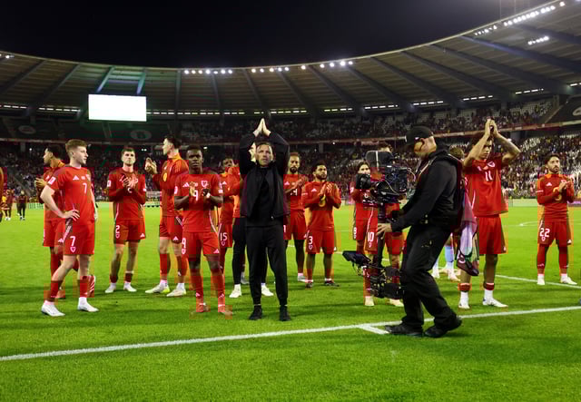 Soccer Football - European Qualifiers - Group J - Belgium v Wales - King Baudouin Stadium, Brussels, Belgium - June 9, 2025 Wales manager Craig Bellamy and players applaud fans after the match REUTERS/Yves Herman