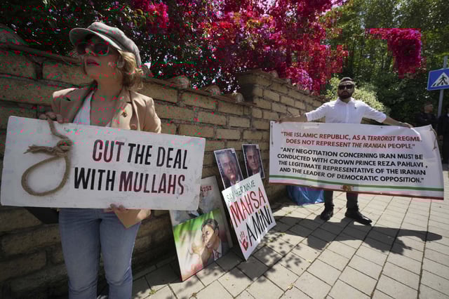 Iranian citizens protest against the current Iranian government outside the Omani Embassy in Rome during the closed-door meeting between U.S. and Iranian delegations to discuss Tehran&#39;s rapidly advancing nuclear program, Friday, May 23, 2025.
