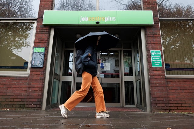 A passer-by walks past a job centre in Borough, in London, Britain, December 1, 2024. REUTERS/Mina Kim