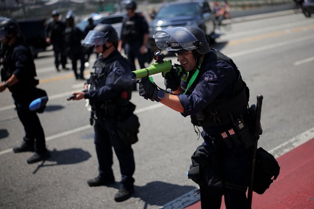 A member of the Los Angeles Metro Police fires a rubber bullet during a protest against federal immigration sweeps in downtown Los Angeles, California, U.S. June 8, 2025.