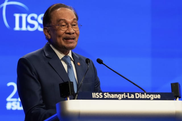 Malaysian Prime Minister Anwar Ibrahim delivers his speech during the 22nd Shangri-La Dialogue summit in Singapore, Saturday, May 31, 2025. (AP Photo/Anupam Nath)