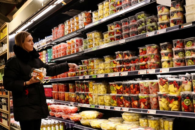 A woman shops for fruit in a store in New York City, U.S., February 12, 2025.  REUTERS/Brendan McDermid