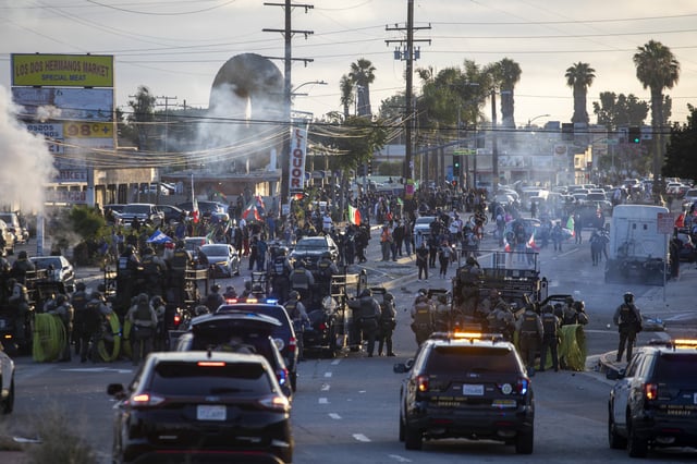 Law enforcement clashes with demonstrators during a protest following federal immigration operations, in the Compton neighborhood of Los Angeles, California on June 7, 2025.