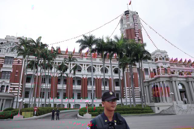 Security guards stand guard in front of the Presidential Office Building in Taipei, Taiwan May 23, 2024. REUTERS/Annabelle Chih/File photo