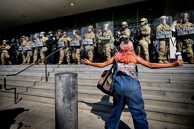 A protester taunts a line of California National Guard protecting a federal building in downtown Los Angeles on Monday, on June 9, 2025.