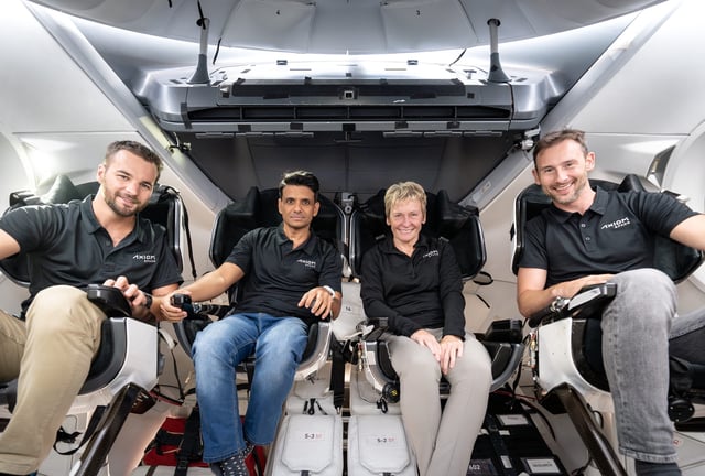 The Axiom 4 crew is photographed inside the SpaceX Dragon spacecraft while training for the mission..