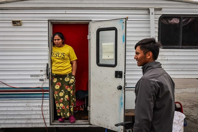 Claudia Avila and Marvin Velasquez, right, outside their RV’s in the Bayview neighborhood in San Francisco.