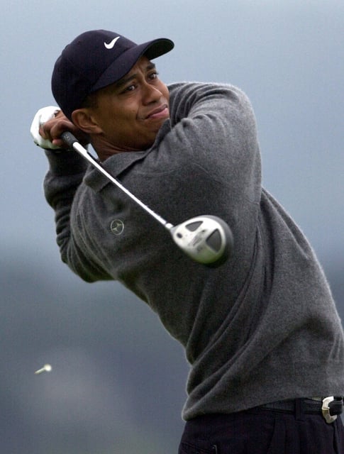 Tiger Woods hits from the 14th tee during the second round of the 100th U.S. Open Golf Championship at the Pebble Beach Golf Links on Saturday, June 17, 2000. Woods finished the second round in the lead at 8-under-par.
