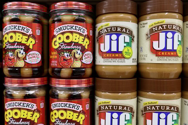 Smucker's Goober Strawberry and Jif peanut butter, brands owned by The J.M. Smucker Company, are seen for sale in a store in Manhattan, New York City, U.S., November 22, 2021. REUTERS/Andrew Kelly/File Photo
