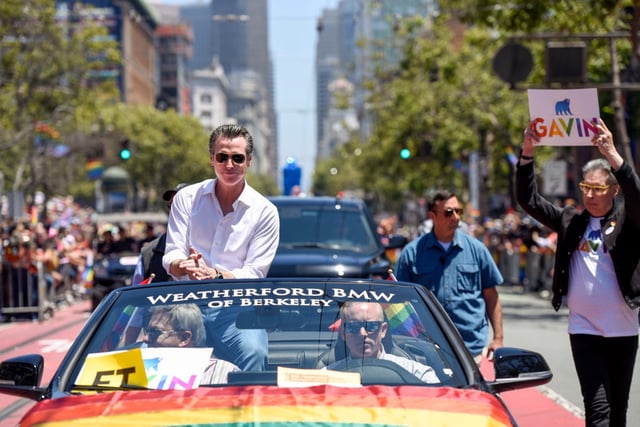 California Governor Gavin Newsom greets parade participants during the San Francisco Gay Pride parade on June 30, 2019 in San Francisco, California (Photo by Meera Fox/Getty Images)