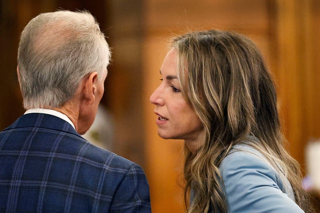Karen Read, right talks with her parents, William and Janet Read, during a break in her murder trial proceedings at Norfolk Superior Court in Dedham, Massachusetts, on Wednesday, June 4, 2025.
