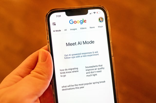 Close-up of a person's hand holding an iPhone and using Google AI Mode, an experimental mode utilizing artificial intelligence and large language models to process Google search queries, Lafayette, California, March 24, 2025. (Photo by Smith Collection/Gado/Getty Images)