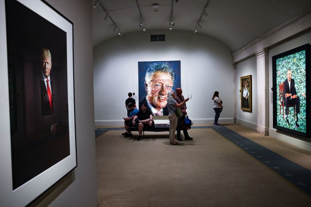 Visitors tour the "America's Presidents" exhibition where portraits of Presidents Donald J. Trump, William J. Clinton, Barack Obama and George W. Bush are on display June 9, 2025 in Washington, D.C.