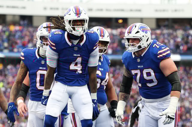James Cook #4 of the Buffalo Bills celebrates after scoring a touchdown against the Denver Broncos during the second quarter during the AFC Wild Card Playoffs at Highmark Stadium on January 12, 2025 in Orchard Park, New York.