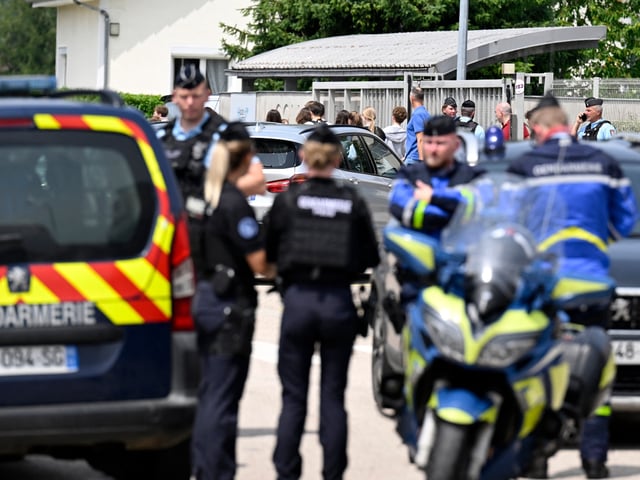 Students leave as French gendarmes control the access to a secondary school after a 31-year-old teaching assistant was stabbed with a knife by a 15-year-old pupil during a bag search in Nogent, eastern France, on June 10, 2025. The teaching assistant, who died of her wounds, received several knife wounds just as classes were starting, and the alleged attacker, who was overpowered by gendarmes, "appears to be a student at the school," education officials said. (Photo by Jean-Christophe VERHAEGEN / AFP) (Photo by JEAN-CHRISTOPHE VERHAEGEN/AFP via Getty Images)