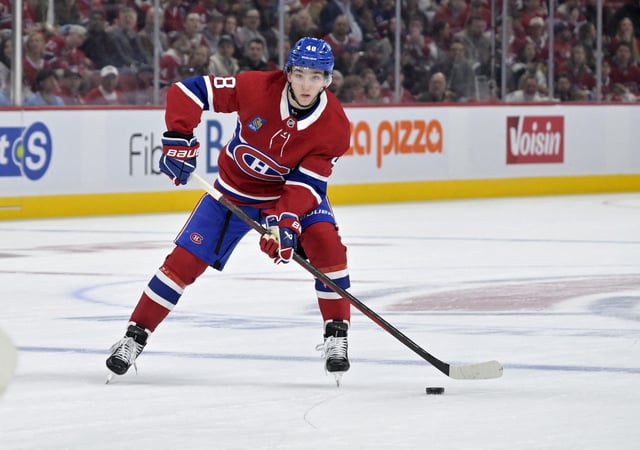 Apr 25, 2025; Montreal, Quebec, CAN; Montreal Canadiens defenseman Lane Hutson (48) plays the puck against the Washington Capitals during the second period in game three of the first round of the 2025 Stanley Cup Playoffs at the Bell Centre. Mandatory Credit: Eric Bolte-Imagn Images/File Photo