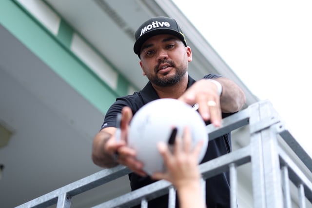 Jun 9, 2025; Oakmont, Pennsylvania, USA; Jason Day signs an autograph during a practice round for the U.S. Open golf tournament at Oakmont Country Club. Mandatory Credit: Bill Streicher-Imagn Images
