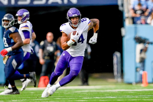 Nov 17, 2024; Nashville, Tennessee, USA; Minnesota Vikings tight end Josh Oliver (84) runs the ball after a made catch against the Tennessee Titans during the first half at Nissan Stadium. Mandatory Credit: Steve Roberts-Imagn Images/File Photo