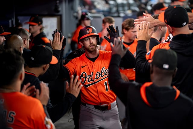 Infielder Jordan Westburg, shown celebrating a home run with his Orioles earlier this season, is with the Tides this week as he works his way back from a fractured left thumb. (Christopher Katsarov/The Canadian Press via AP)
