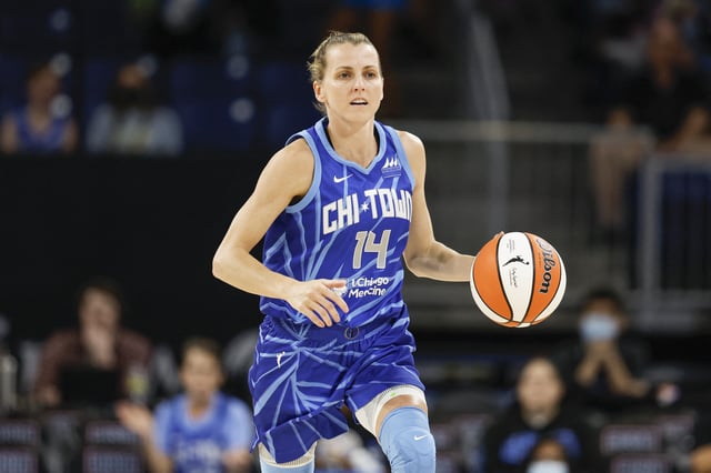 Jul 29, 2022; Chicago, Illinois, USA; Chicago Sky guard Allie Quigley (14) brings the ball up court against the New York Liberty during the first half of the WNBA game at Wintrust Arena. Mandatory Credit: Kamil Krzaczynski-USA TODAY Sports/File Photo