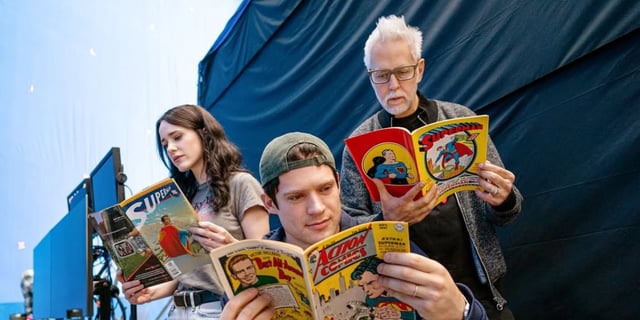 Rachel Brosnahan James Gunn and David Corenswet reading superman comics