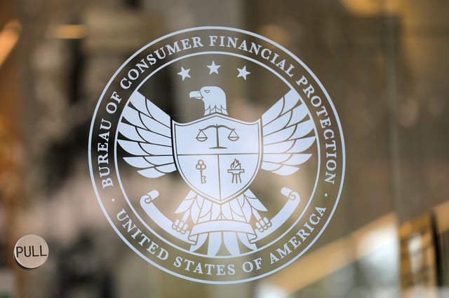 Signage is seen at the Consumer Financial Protection Bureau (CFPB) headquarters in Washington, D.C., U.S., August 29, 2020. REUTERS/Andrew Kelly/File Photo