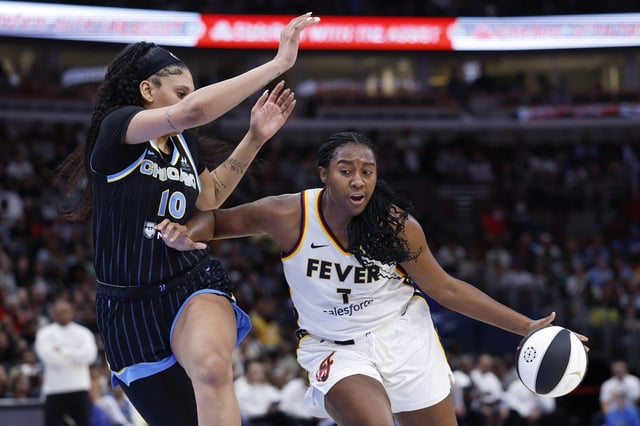 Jun 7, 2025; Chicago, Illinois, USA; Indiana Fever forward Aliyah Boston (7) drives to the basket against Chicago Sky center Kamilla Cardoso (10) during the first half of a WNBA game at United Center. Mandatory Credit: Kamil Krzaczynski-Imagn Images