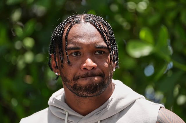 Miami Dolphins quarterback Tua Tagovailoa speaks to the press after a practice at NFL football minicamp, Tuesday, June 10, 2025, in Miami Gardens, Fla. (AP Photo/Rebecca Blackwell)