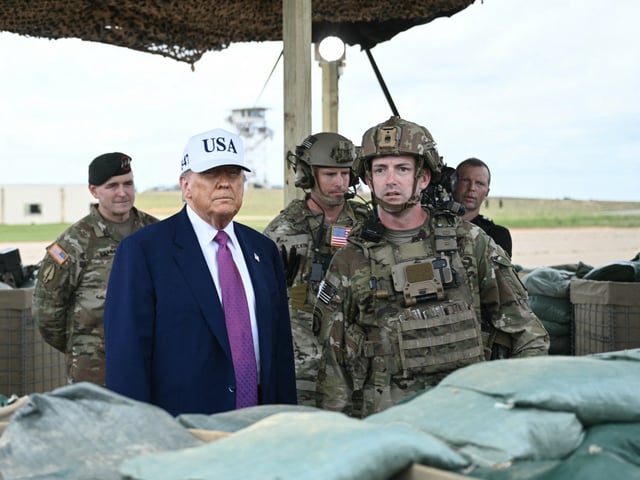 US President Donald Trump watches a military demonstration at Fort Bragg, a US Army military installation, near Fayetteville, North Carolina, on June 10, 2025. (Photo by BRENDAN SMIALOWSKI/AFP via Getty Images)