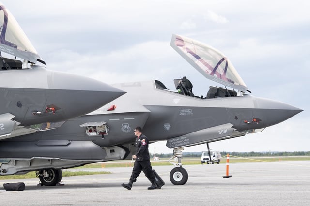 A ground crew member of the F-35A Lightning II fighter demonstration team works on a jet following its arrival at the airport Wednesday September 4, 2019 in Ottawa. The jet is part of a demonstration team in town for a weekend air show. THE CANADIAN PRESS/Adrian Wyld