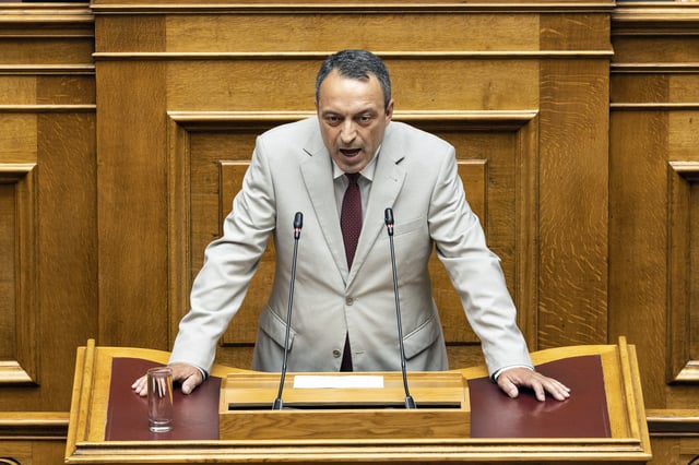 FILE - Leader of Spartans party, Vasilis Stigas, addresses lawmakers during a parliament session in Athens, Greece, Saturday, July 8, 2023. (AP Photo/Yorgos Karahalis, File)