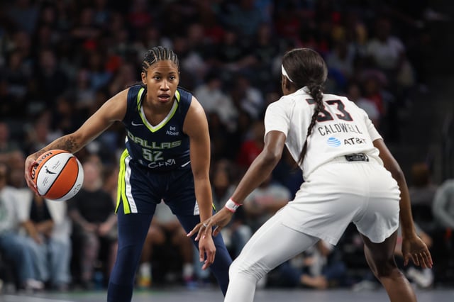 May 24, 2025; College Park, Georgia, USA; Atlanta Dream guard Maya Caldwell (33) plays defense against Dallas Wings guard Tyasha Harris (52) during the first quarter at Gateway Center Arena at College Park. Mandatory Credit: Jordan Godfree-Imagn Images/File Photo