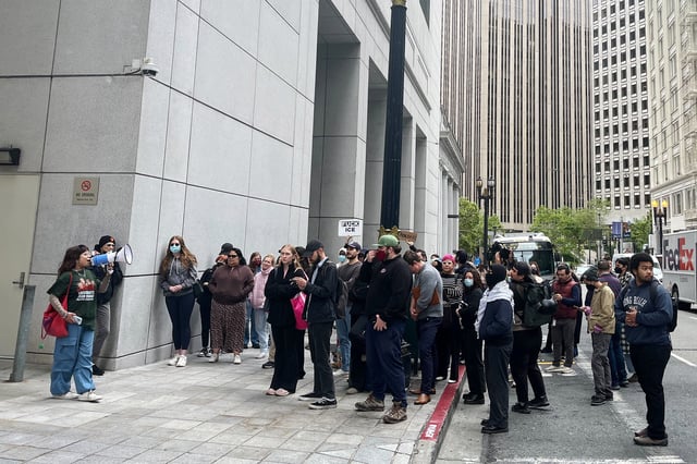 Protesters gather outside the San Francisco Immigration Court on Montgomery Street to rally against arrests by U.S. Immigration and Customs Enforcement agents.