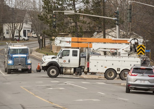 An NB Power truck drives through an intersection in Fredericton, on Tuesday, Dec. 19, 2023. THE CANADIAN PRESS/Stephen MacGillivray