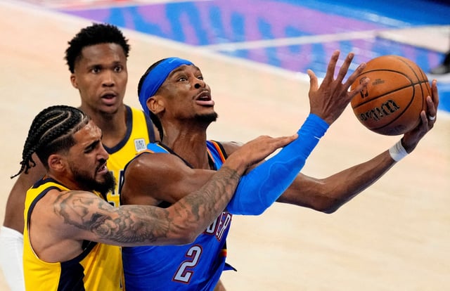 Jun 8, 2025; Oklahoma City, Oklahoma, USA; Oklahoma City Thunder guard Shai Gilgeous-Alexander (2) shoots the ball against Indiana Pacers forward Obi Toppin (1) during the second half during game two of the 2025 NBA Finals at Paycom Center. Mandatory Credit: Kyle Terada-Imagn Images/File Photo