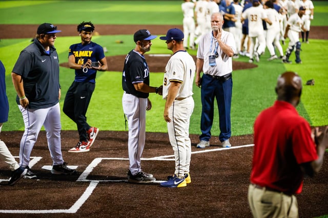 Jun 9, 2025; Durham, NC, USA; Murray State Head Coach Dan Skirka celebrates a win with Duke Head Coach Chris Pollard after the ninth inning of the Durham Super Regional against Duke at Jack Coombs Field. Mandatory Credit: Jaylynn Nash-Imagn Images