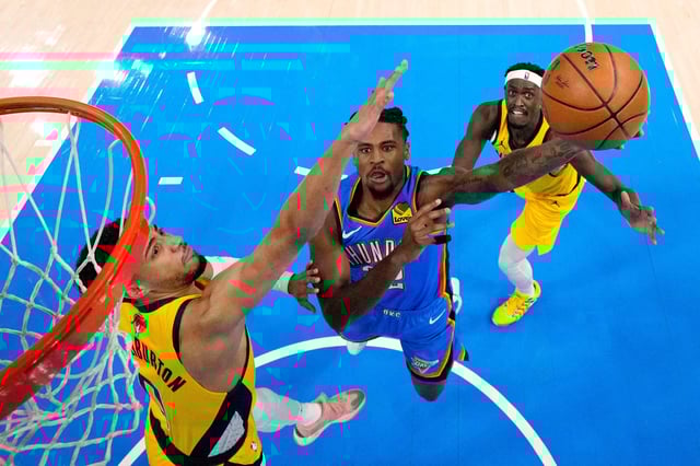 Jun 8, 2025; Oklahoma City, Oklahoma, USA; Oklahoma City Thunder guard Cason Wallace (22) shoots against Indiana Pacers guard Tyrese Haliburton (0) during the first half during game two of the 2025 NBA Finals at Paycom Center. Mandatory Credit: Matthew Stockman-Pool Photo via Imagn Images/File Photo