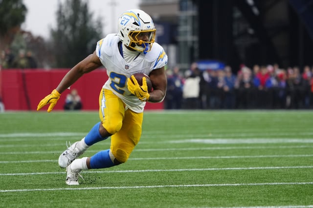 Dec 28, 2024; Foxborough, Massachusetts, USA; Los Angeles Chargers running back J.K. Dobbins (27) runs with the ball against the New England Patriots during the second half at Gillette Stadium. Mandatory Credit: Gregory Fisher-Imagn Images/File Photo
