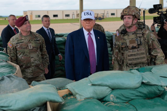 President Donald Trump is joined by 18th Airborne Corps Commander Lt. Gen. Gregory Anderson (in beret) and other military and civilian leaders, including Veterans Affairs Secretary Doug Collins and Defense Secretary Pete Hegseth, as they watch a demonstration by Special Operations soldiers in Fort Bragg, N.C.