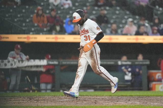 May 28, 2025; Baltimore, Maryland, USA; Baltimore Orioles center fielder Cedric Mullins (31) scores a run on Baltimore Orioles center fielder Dylan Carlson (15) (not pictured) RBI single against the St. Louis Cardinals during the fourth inning at Oriole Park at Camden Yards. Mandatory Credit: Gregory Fisher-Imagn Images/File Photo