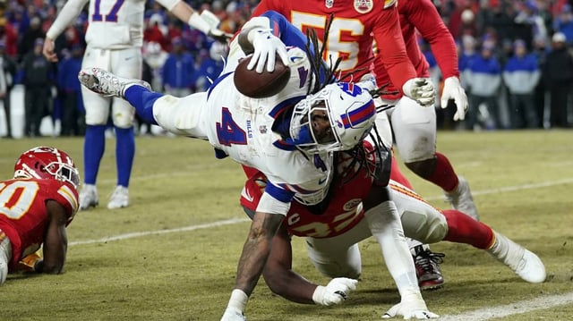 Jan 26, 2025; Kansas City, MO, USA; Buffalo Bills running back James Cook (4) dives for a touchdown against the Kansas City Chiefs during the second half in the AFC Championship game at GEHA Field at Arrowhead Stadium. Mandatory Credit: Denny Medley-Imagn Images