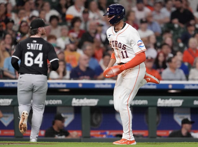 Houston Astros Cam Smith (11) scores on a sac-fly by Isaac Paredes in the third inning of an MLB baseball game in Houston, Tuesday, June 10, 2025.